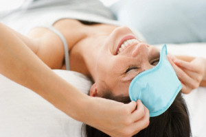 Woman wearing sleep mask